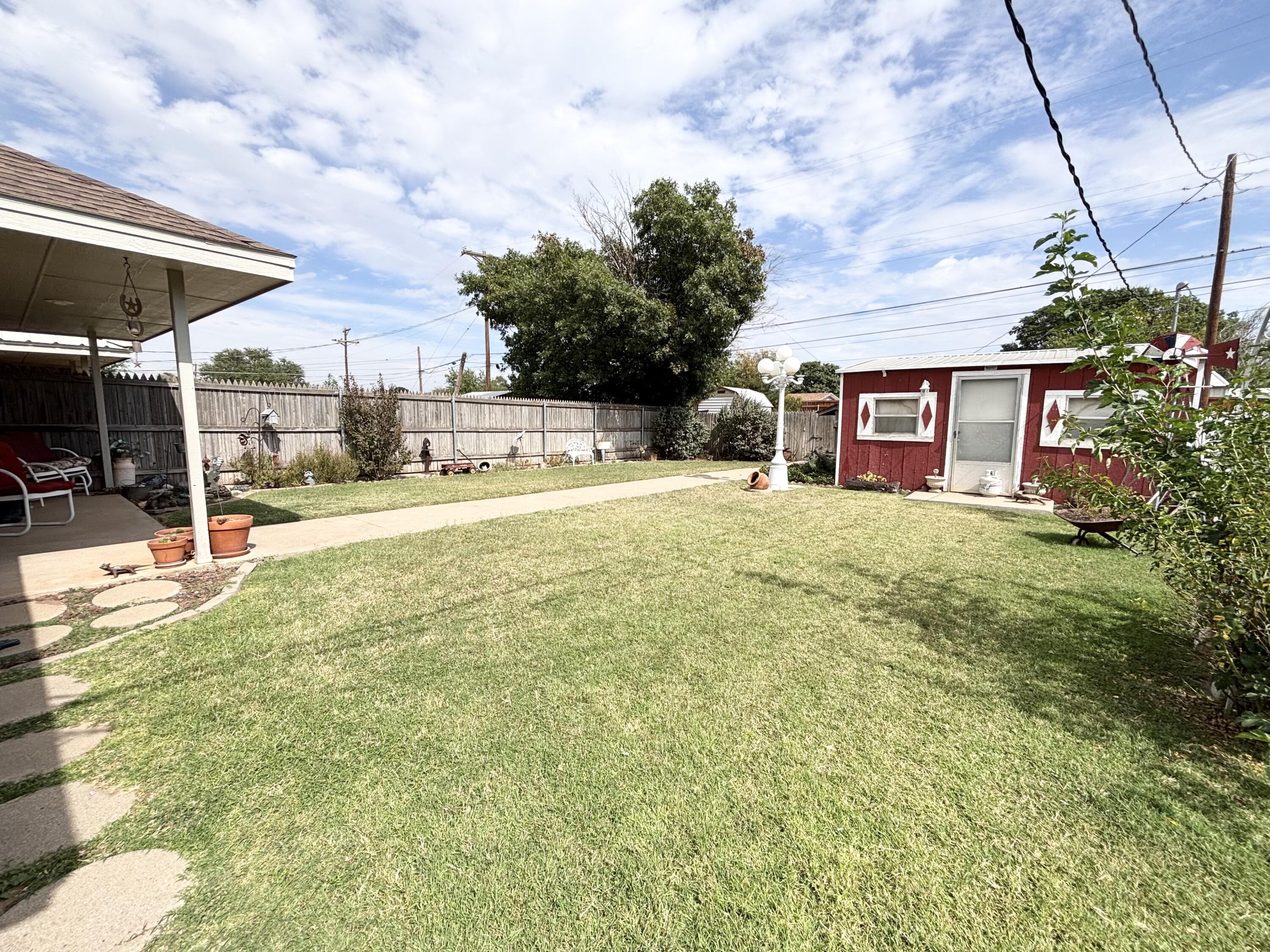 306 Ave M Abernathy, TX 79311 - Photo 18 of 22 a view of a house with backyard and sitting area