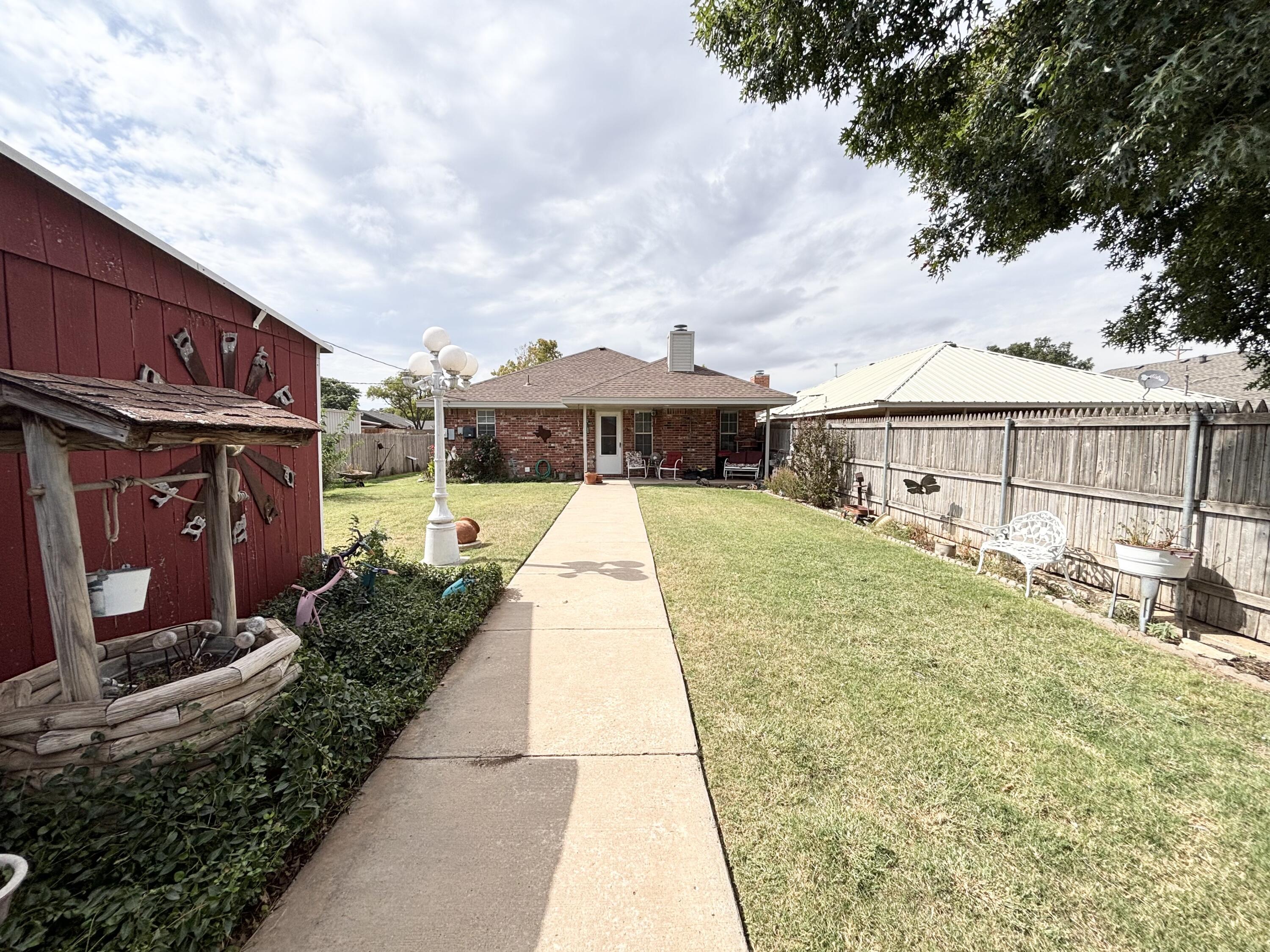 306 Ave M Abernathy, TX 79311 - Photo 19 of 22 a view of swimming pool with a garden