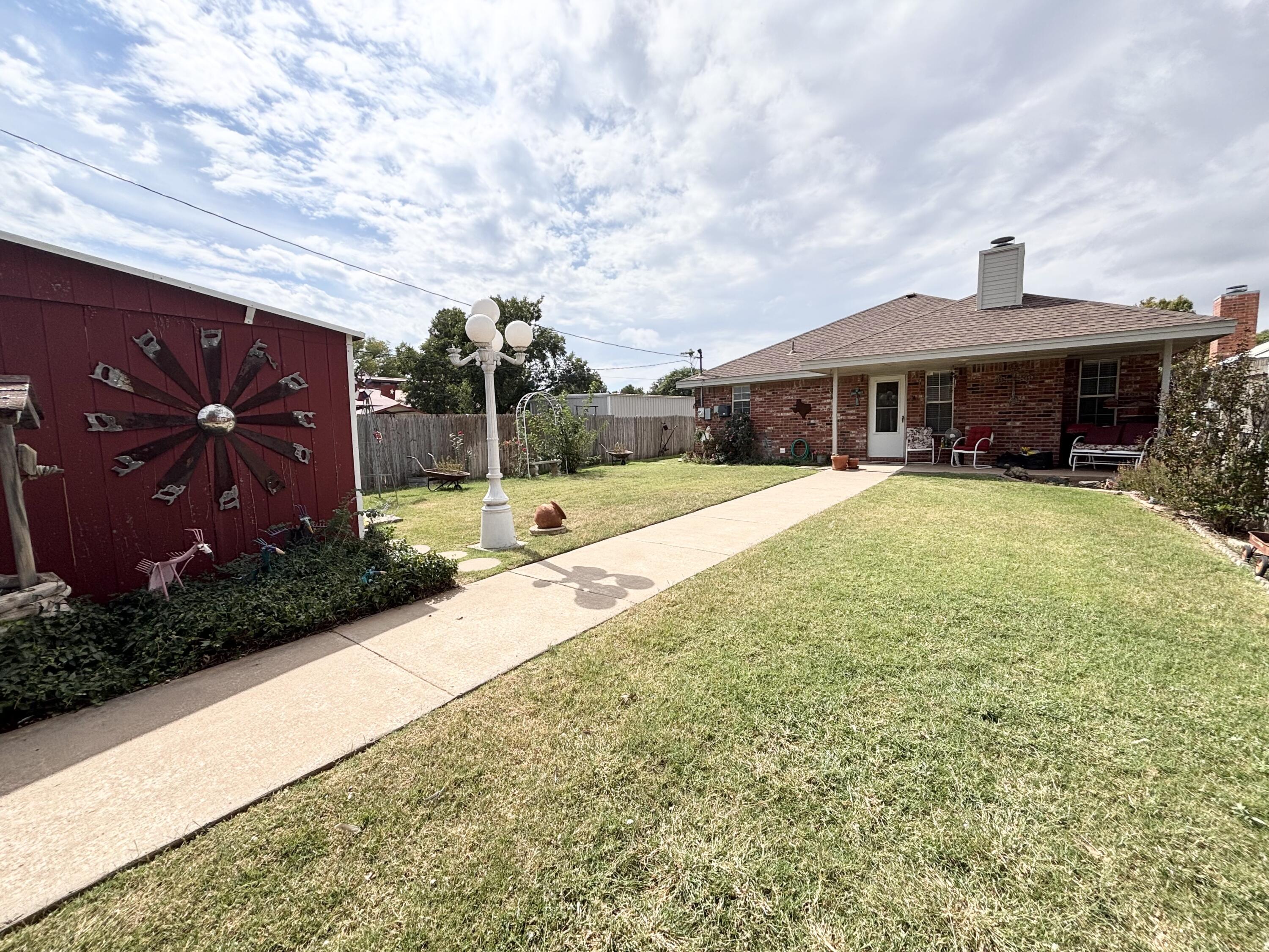 306 Ave M Abernathy, TX 79311 - Photo 20 of 22 a view of a house with garden and pathway