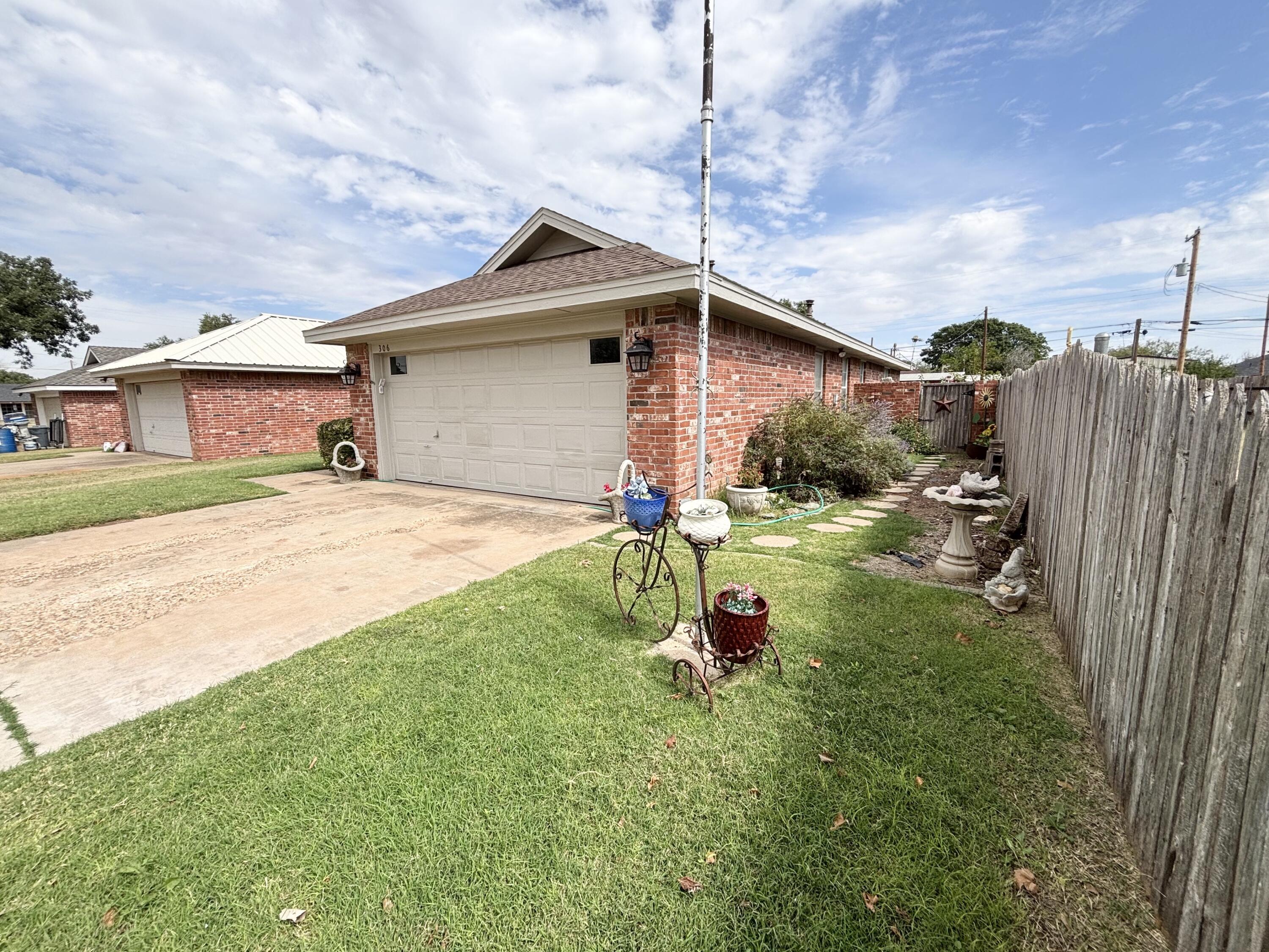 306 Ave M Abernathy, TX 79311 - Photo 2 of 22 a front view of a house with garden