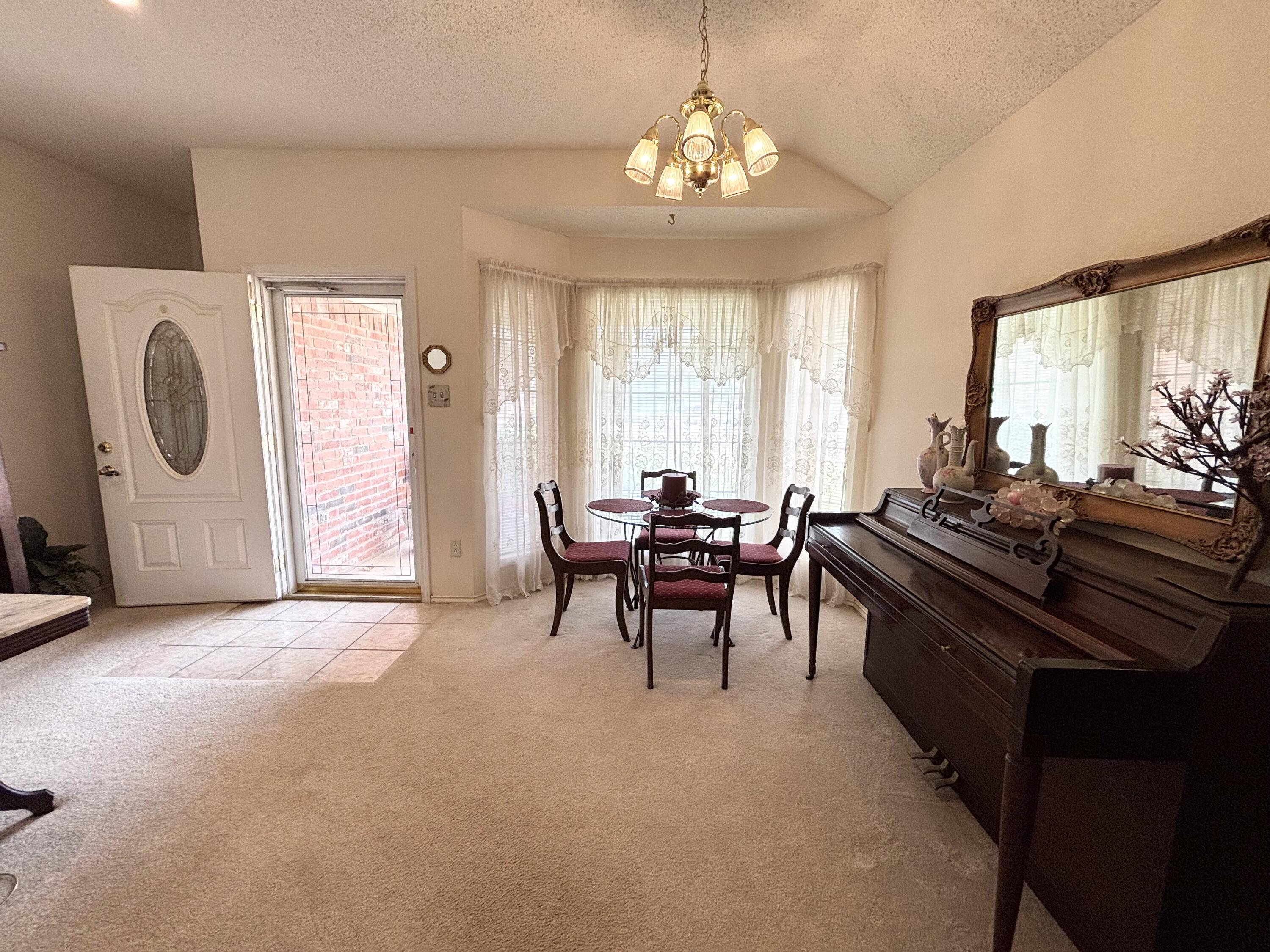 306 Ave M Abernathy, TX 79311 - Photo 5 of 22 a view of a dining room with furniture window and outside view