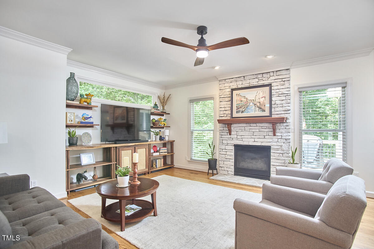 407 Crickentree Drive Cary, NC 27518 - Photo 15 of 78 a living room with furniture fireplace and window