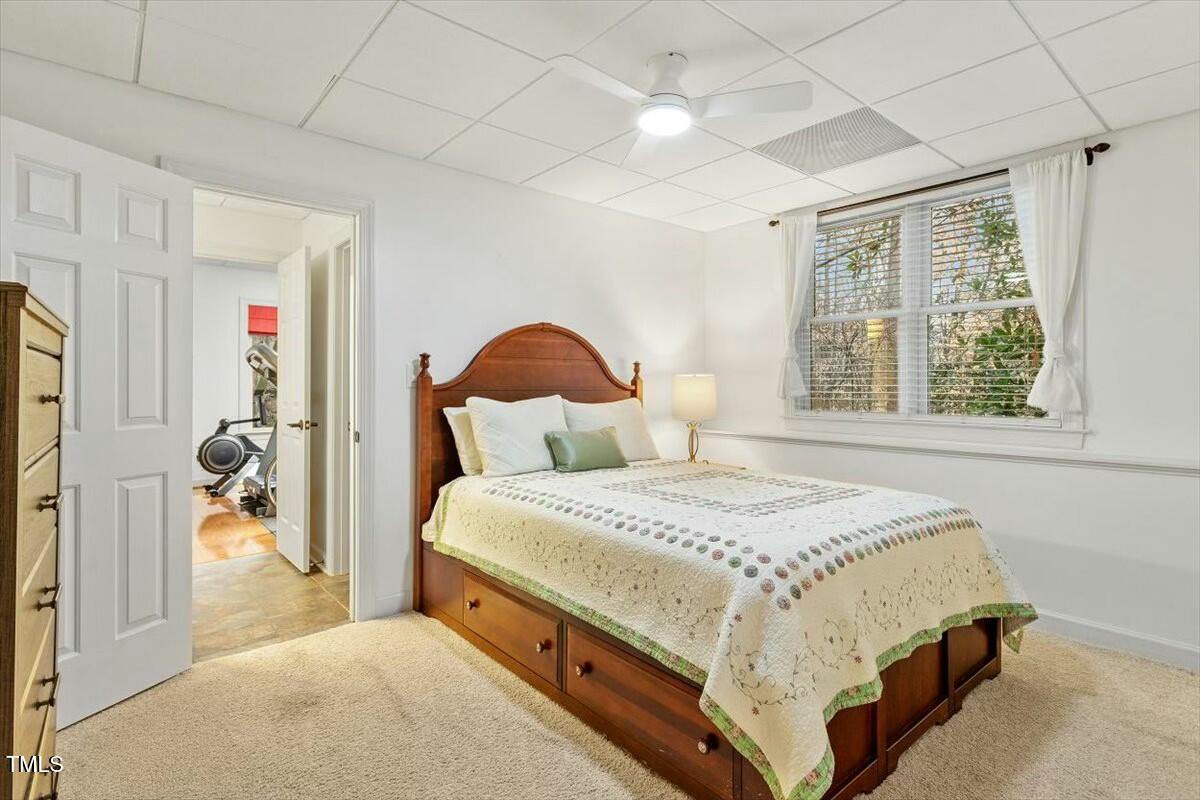 407 Crickentree Drive Cary, NC 27518 - Photo 68 of 78 a bedroom with a large bed and a window