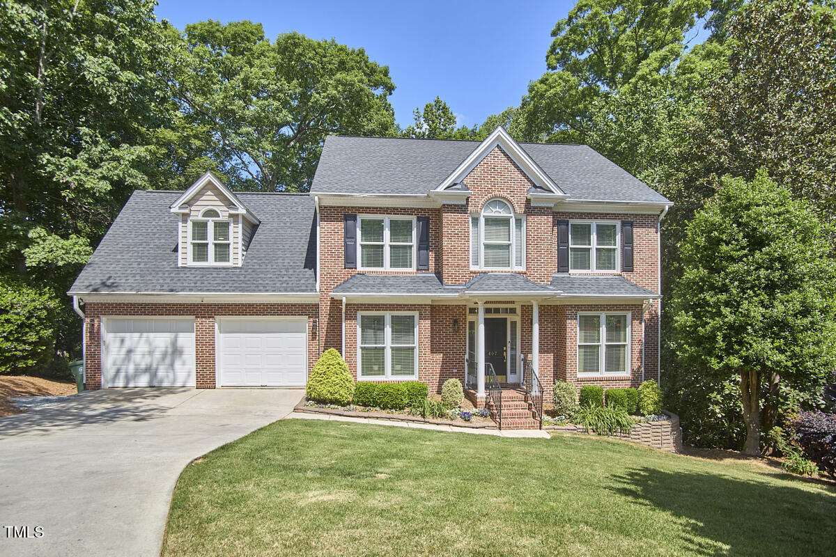 407 Crickentree Drive Cary, NC 27518 - Photo 78 of 78 front view of a house with a yard