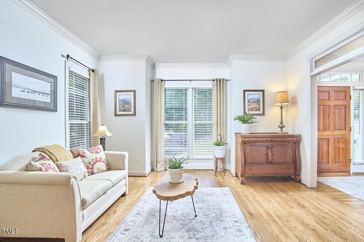 407 Crickentree Drive Cary, NC 27518 - Photo 9 of 78 a living room with furniture and a window