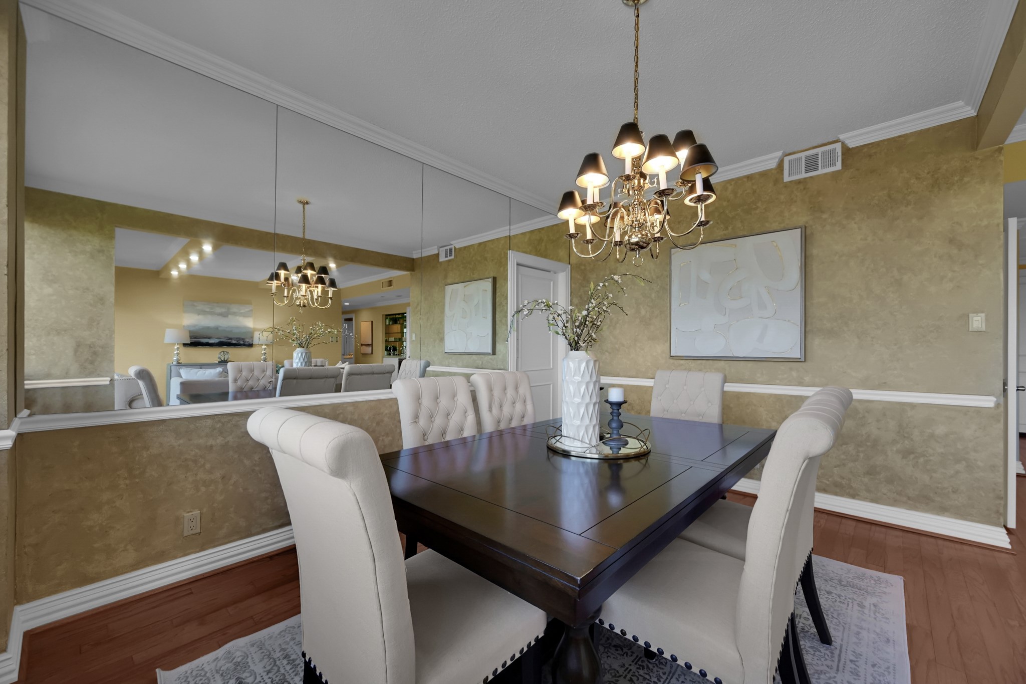 49 Briar Hollow Lane, Unit 504 Houston, TX 77027 - Photo 8 of 25 a view of a dining room with a table and chairs