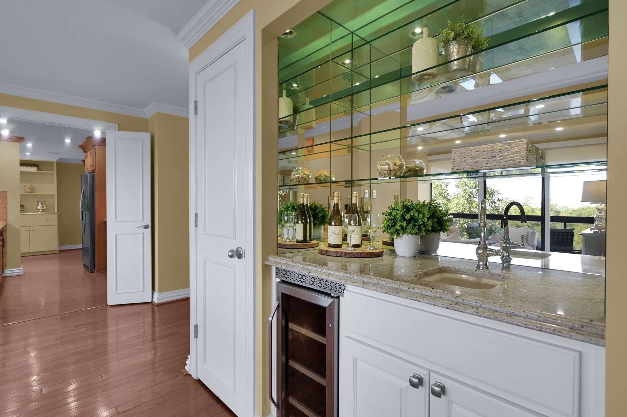 49 Briar Hollow Lane, Unit 504 Houston, TX 77027 - Photo 9 of 25 a kitchen with counter top space and wooden floor