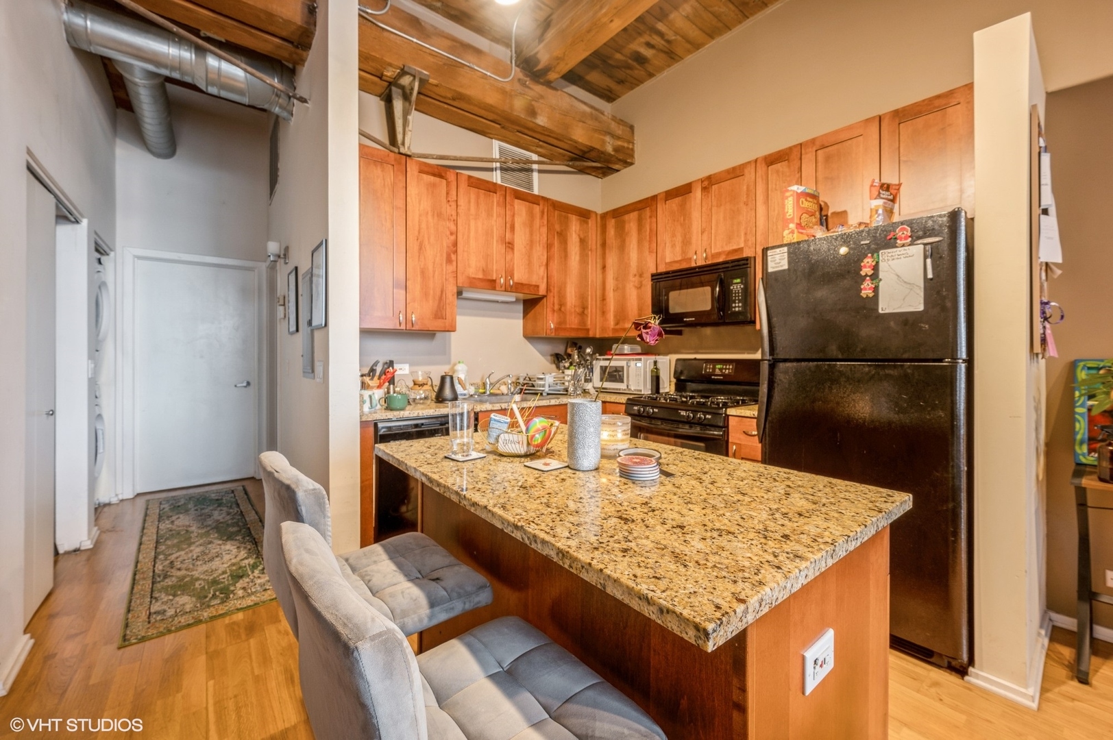 1061 West 16th Street, Unit 201 Chicago, IL 60608 - Photo 3 of 14 a kitchen with a refrigerator and a sink