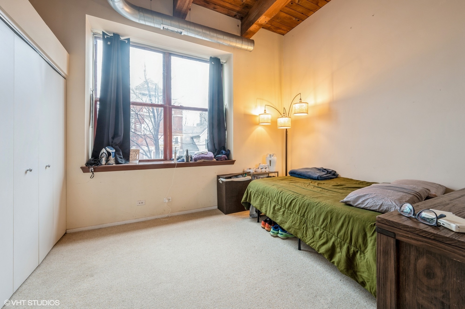1061 West 16th Street, Unit 201 Chicago, IL 60608 - Photo 7 of 14 a bedroom with bed and window