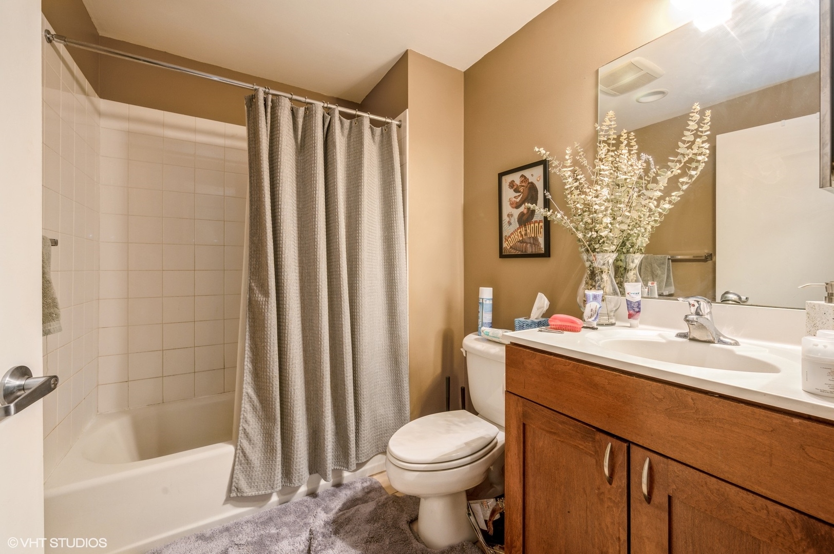 1061 West 16th Street, Unit 201 Chicago, IL 60608 - Photo 8 of 14 a bathroom with a sink toilet and shower