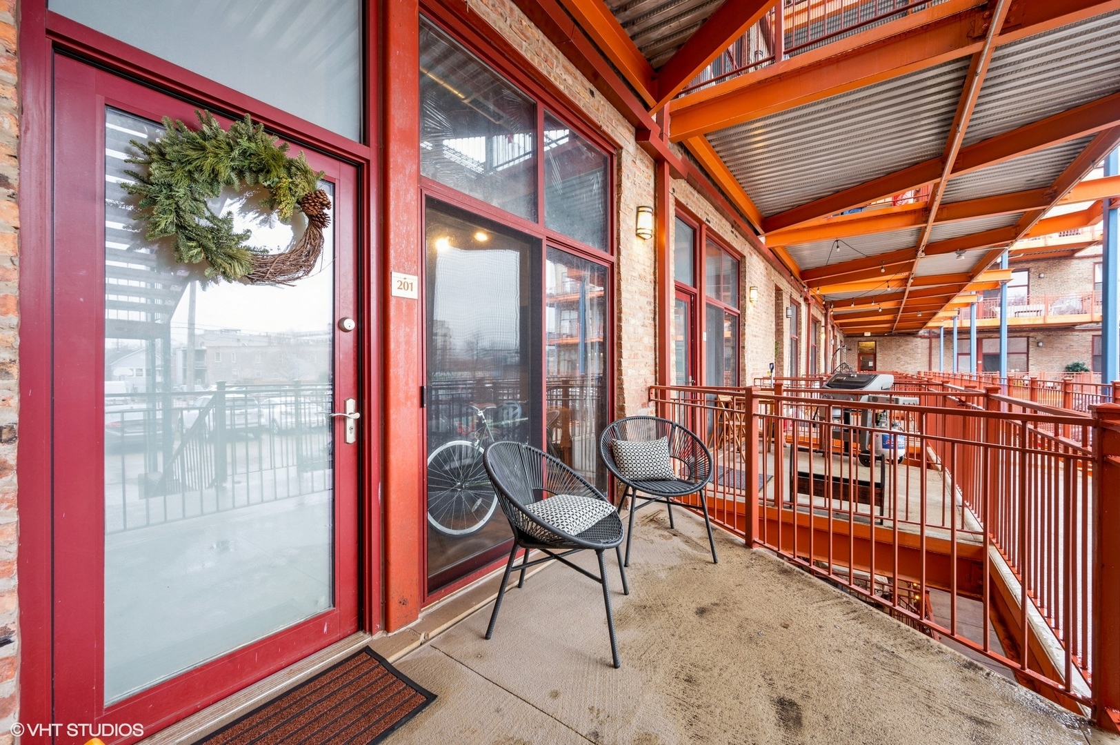 1061 West 16th Street, Unit 201 Chicago, IL 60608 - Photo 9 of 14 a view of a chairs and table in a balcony