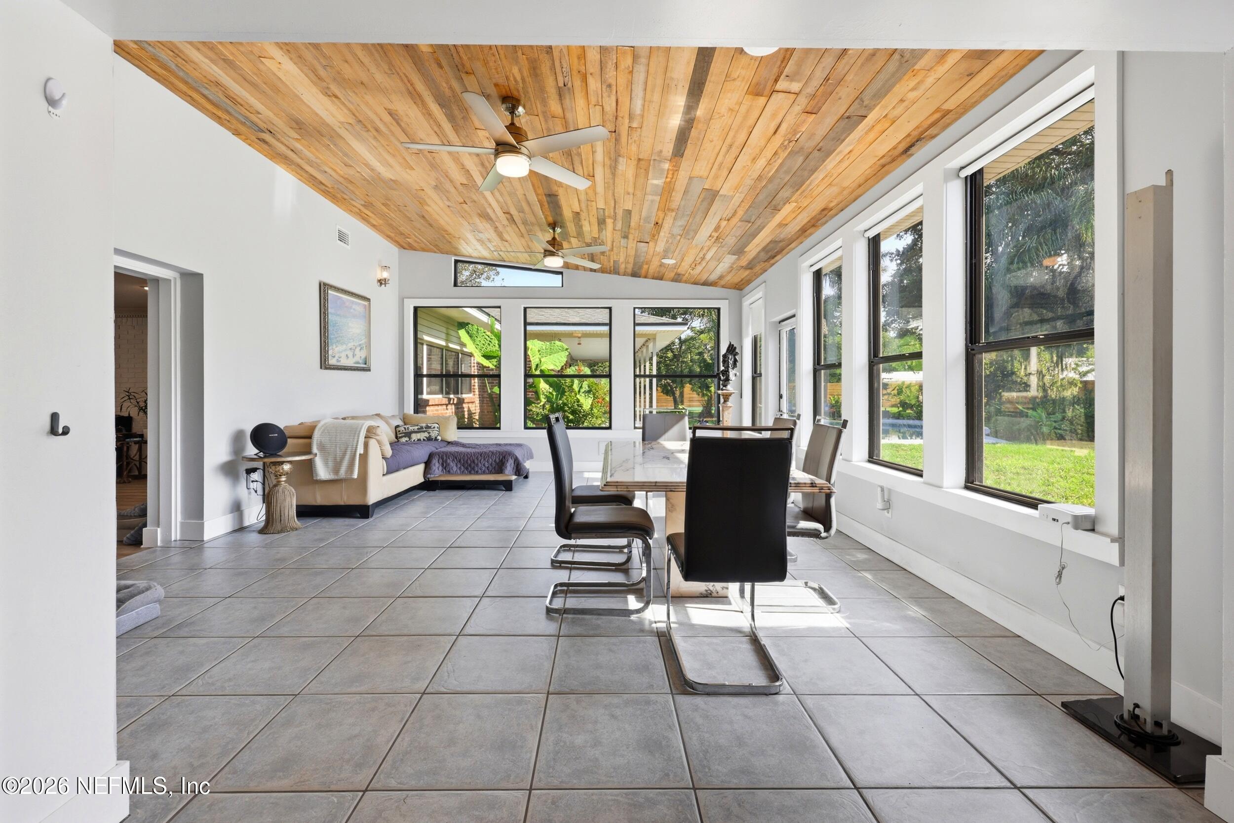 11627 Mandarin Terrace Road Jacksonville, FL 32223 - Photo 56 of 79 a living room with furniture and a large window
