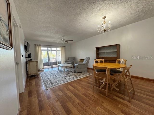 11485 Oakhurst Road, Unit 319 Largo, FL 33774 - Photo 10 of 63 a view of a dining room with furniture window and wooden floor