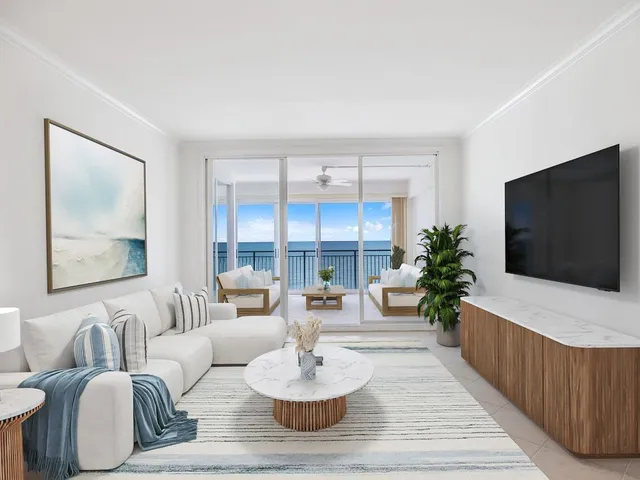 a living room with furniture a flat screen tv and a large window