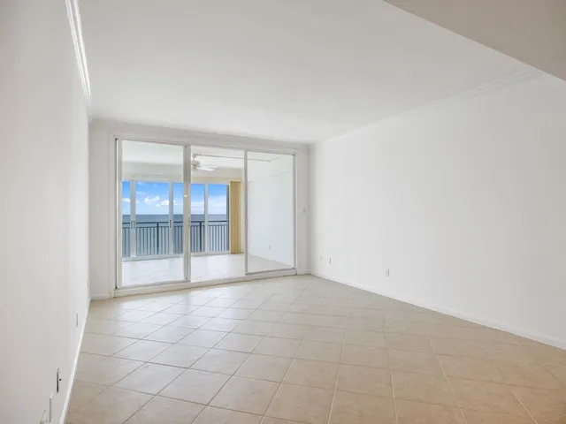 wooden floor in an empty room with a fireplace