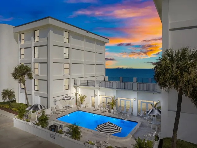 a front view of a house with swimming pool