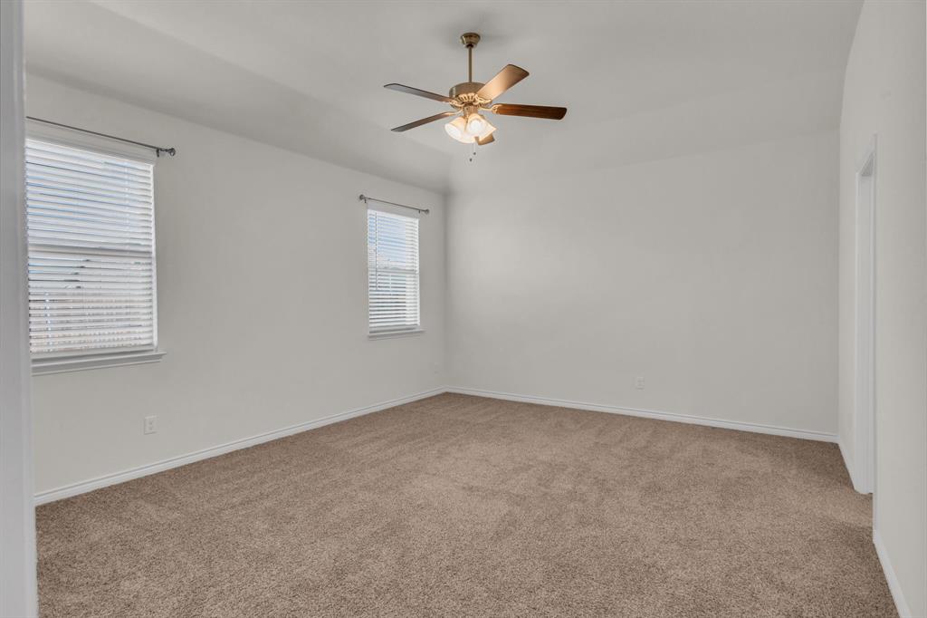 3106 Maverick Drive Forney, TX 75126 - Photo 14 of 29 an empty room with a window and a fan
