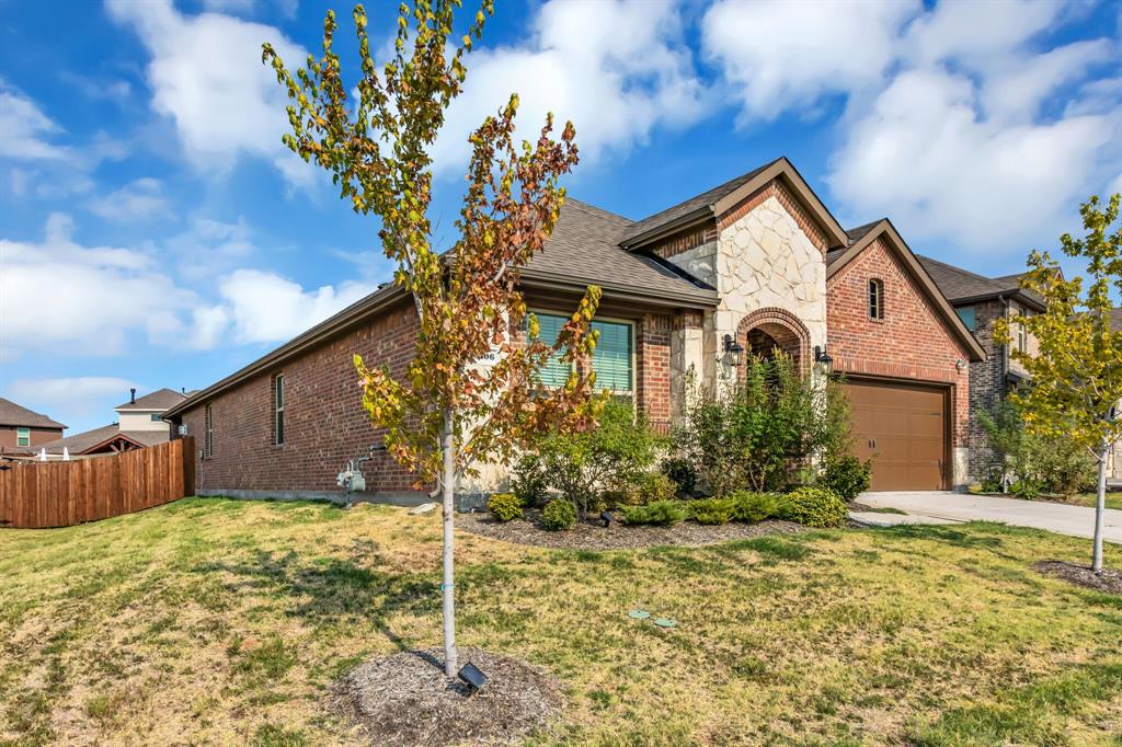 3106 Maverick Drive Forney, TX 75126 - Photo 2 of 29 a front view of a house with garden