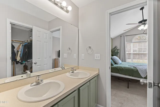 a en suite bathroom with a sink and a mirror