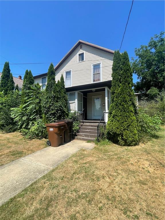 233 East Pine Street Grove City, PA 16127 - Photo 1 of 26 a front view of a house with a yard