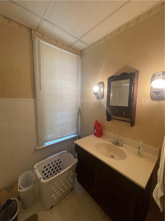 233 East Pine Street Grove City, PA 16127 - Photo 16 of 26 a bathroom with a sink vanity and a mirror