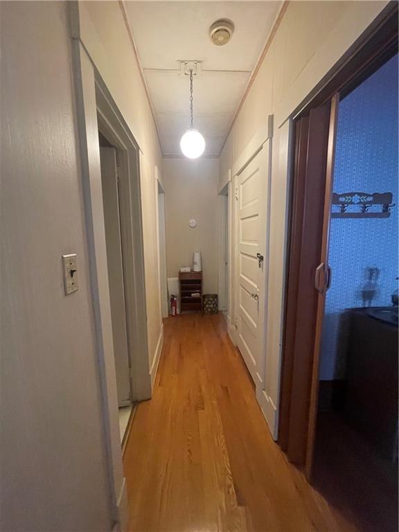 233 East Pine Street Grove City, PA 16127 - Photo 20 of 26 a view of a hallway with wooden floor and furniture
