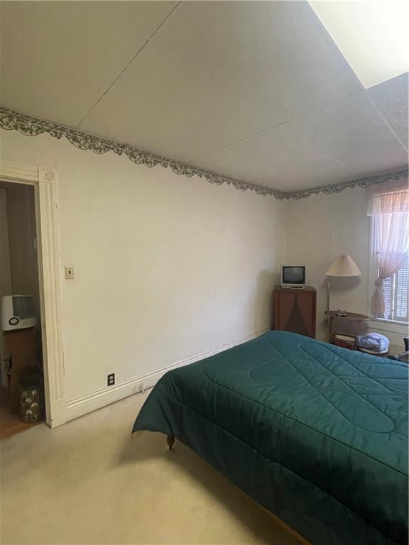 233 East Pine Street Grove City, PA 16127 - Photo 25 of 26 a bedroom with a bed and window