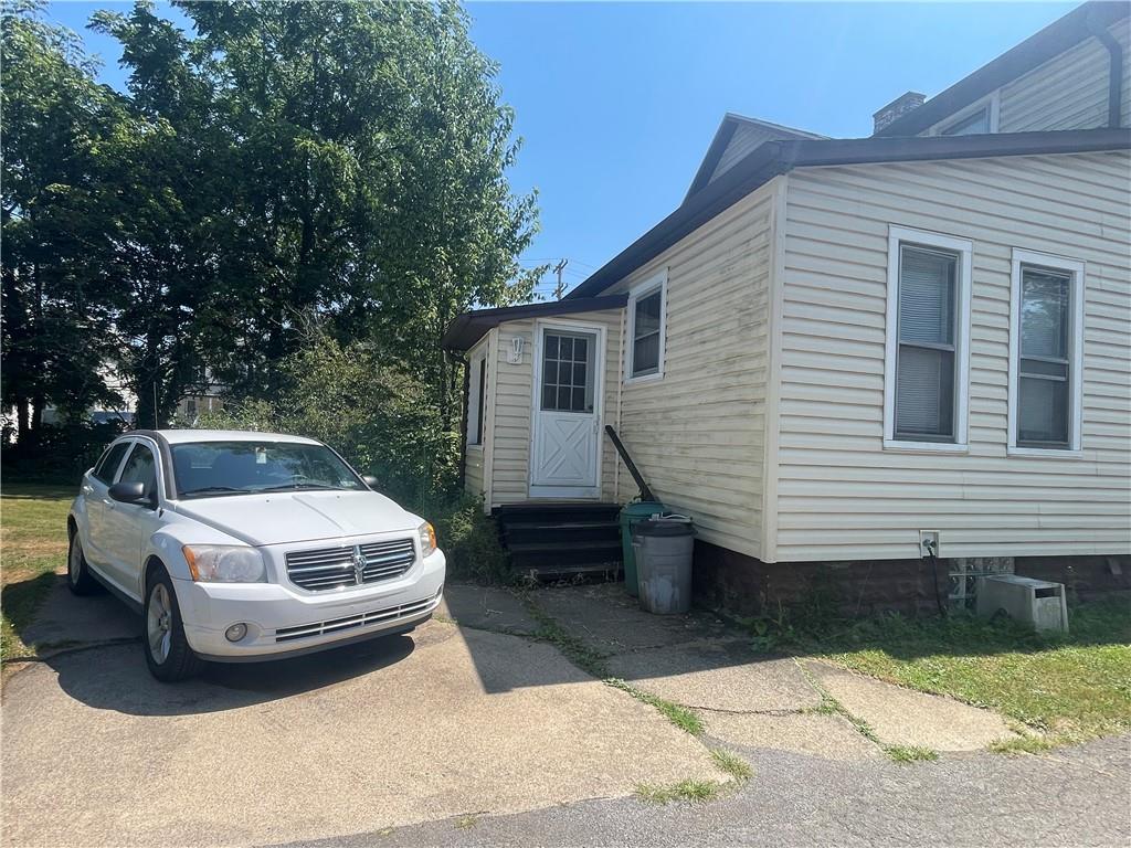 233 East Pine Street Grove City, PA 16127 - Photo 3 of 26 a car parked in front of white house