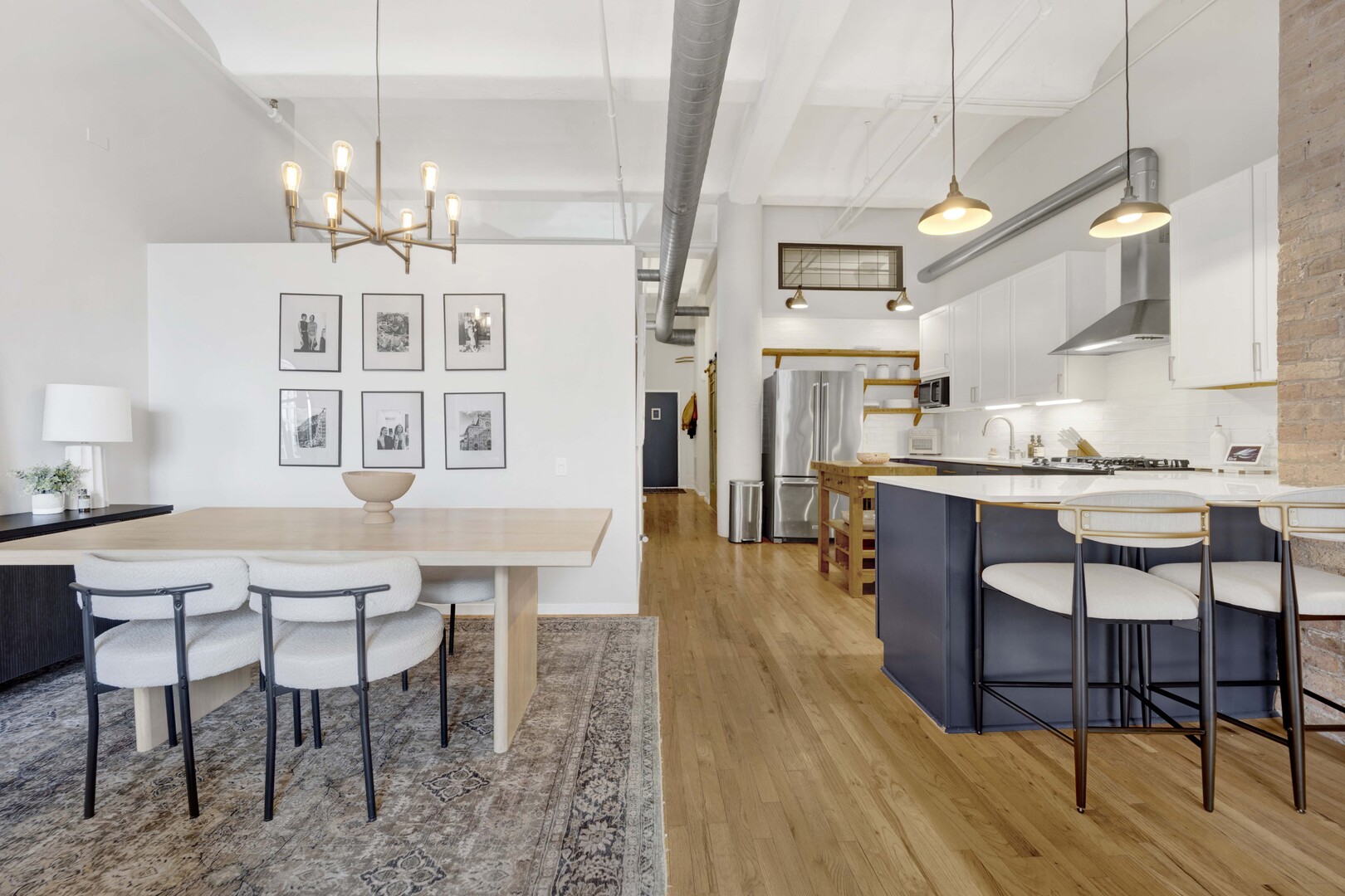 1000 West Washington Boulevard, Unit 305 Chicago, IL 60607 - Photo 11 of 21 a view of a dining room with furniture and wooden floor