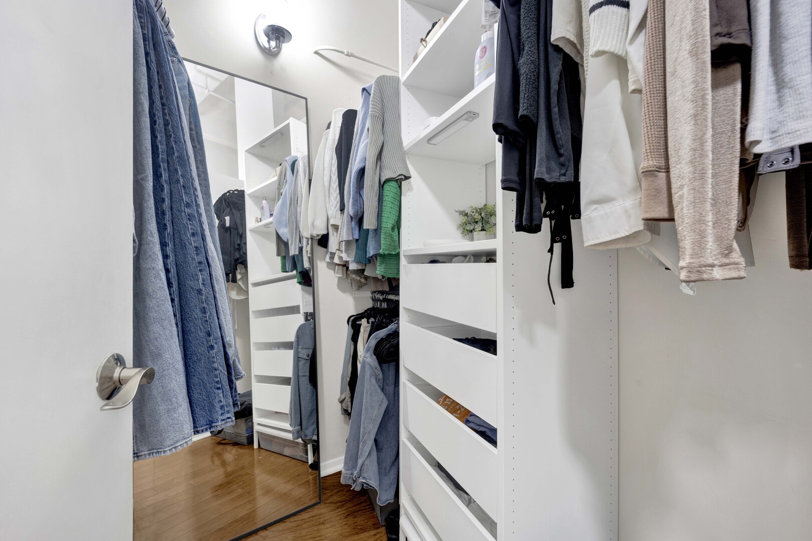 1000 West Washington Boulevard, Unit 305 Chicago, IL 60607 - Photo 16 of 21 a view of walk in closet with clothes and shoes