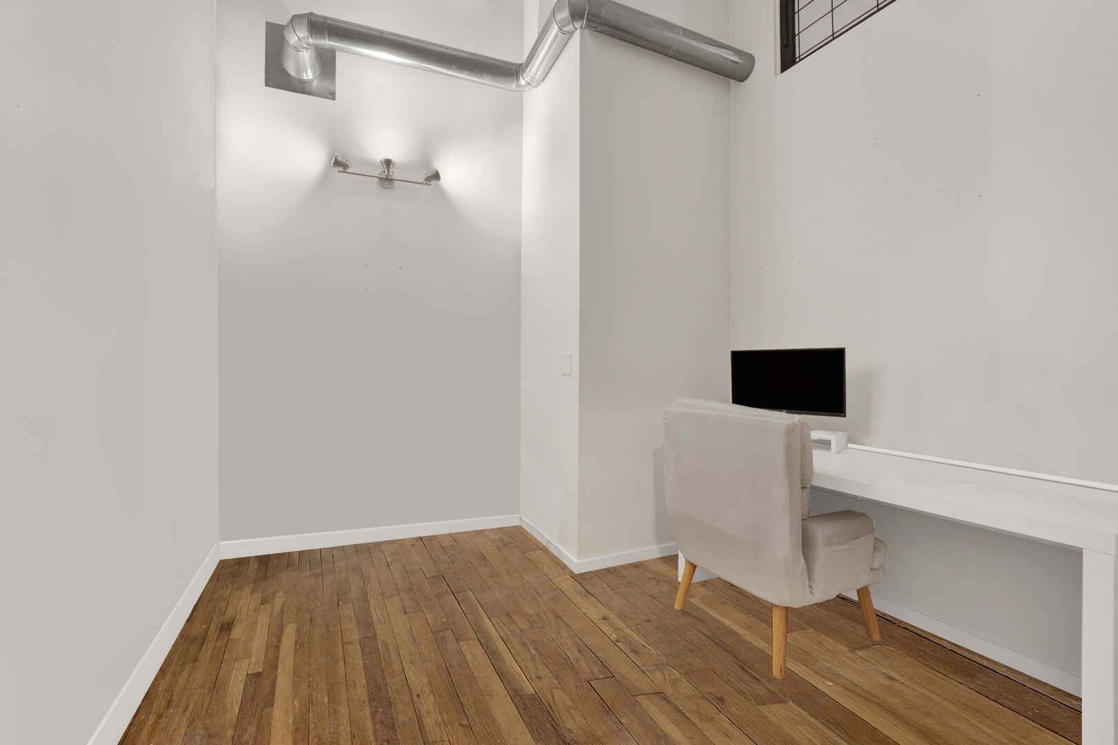 1000 West Washington Boulevard, Unit 305 Chicago, IL 60607 - Photo 18 of 21 a view of small space with wooden floor and a window