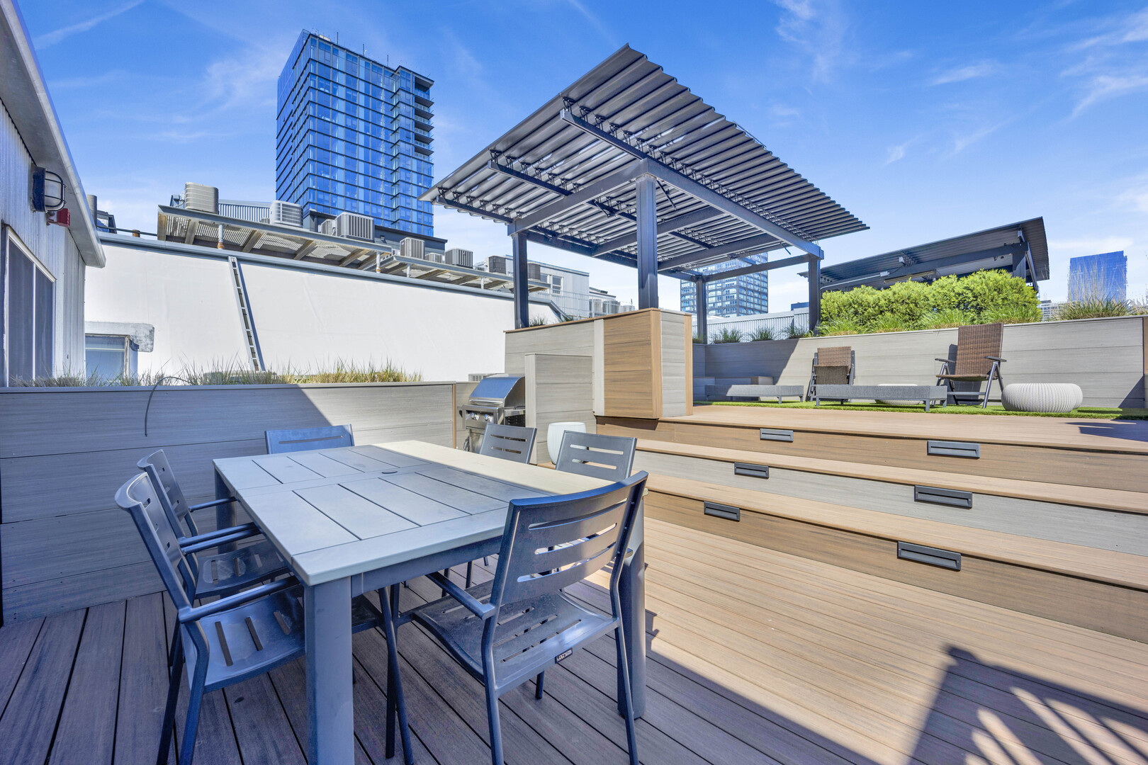 1000 West Washington Boulevard, Unit 305 Chicago, IL 60607 - Photo 21 of 21 a view of a terrace with table and chairs