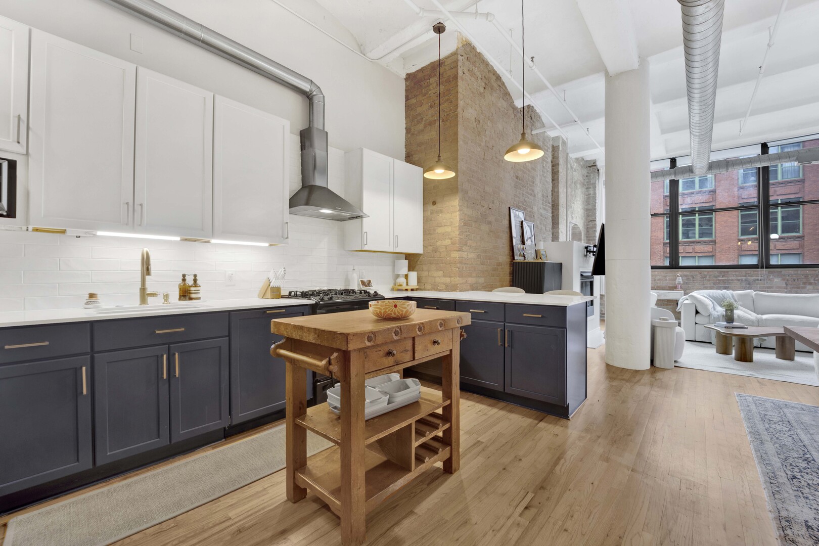 1000 West Washington Boulevard, Unit 305 Chicago, IL 60607 - Photo 3 of 21 a kitchen with a sink cabinets and wooden floor