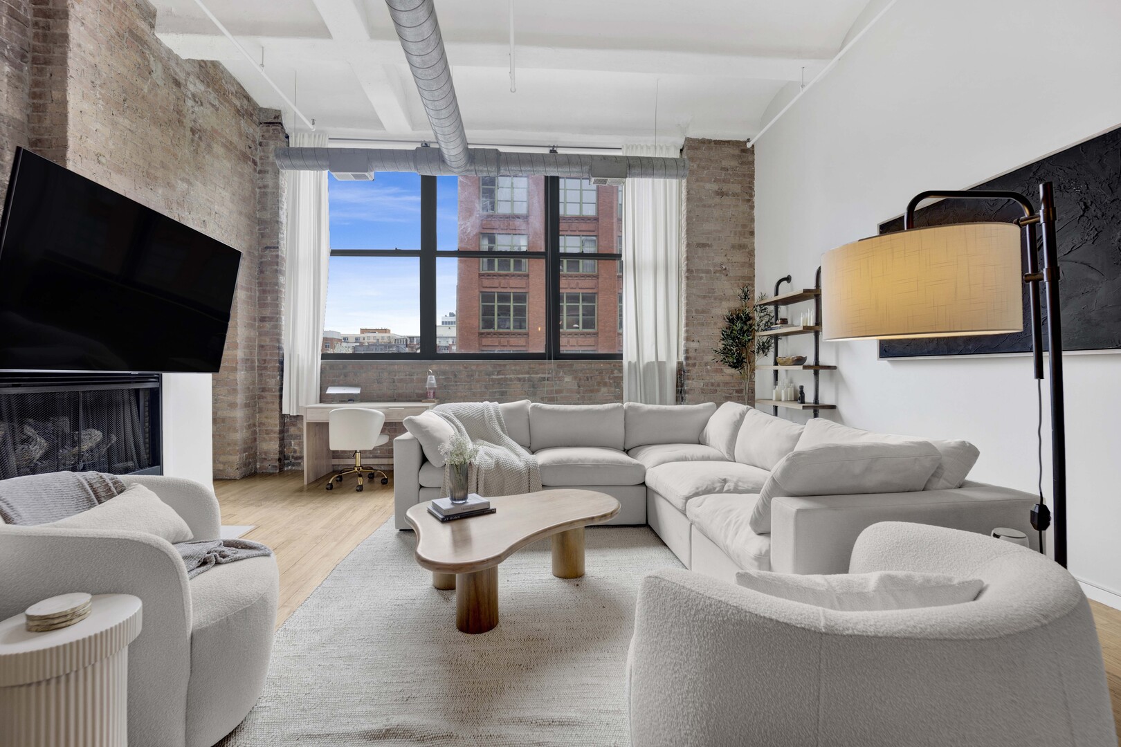 1000 West Washington Boulevard, Unit 305 Chicago, IL 60607 - Photo 9 of 21 a living room with furniture and a flat screen tv