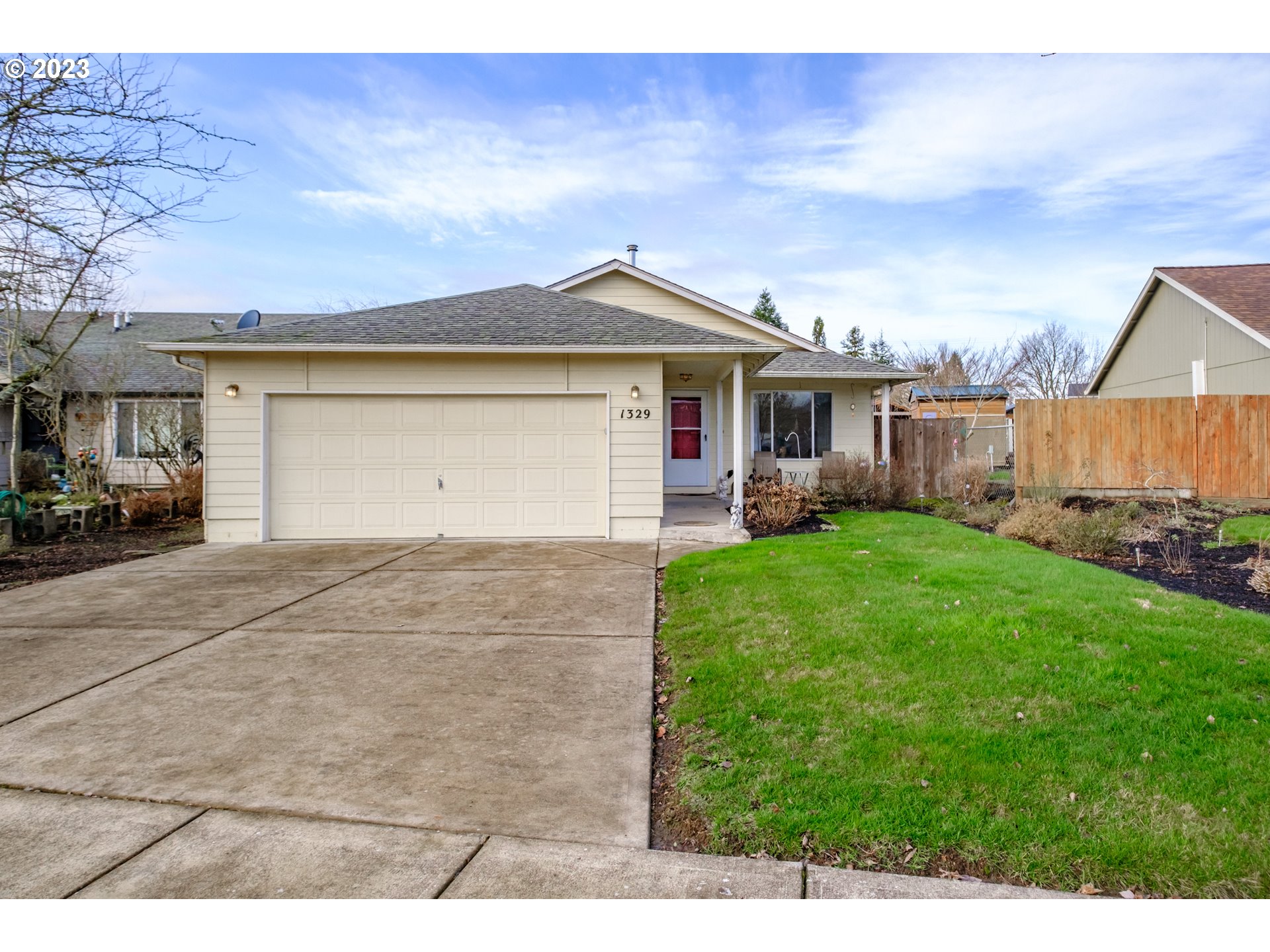 1329 Briar Road Independence, OR 97351 - Photo 1 of 27 a front view of a house with a yard and garage