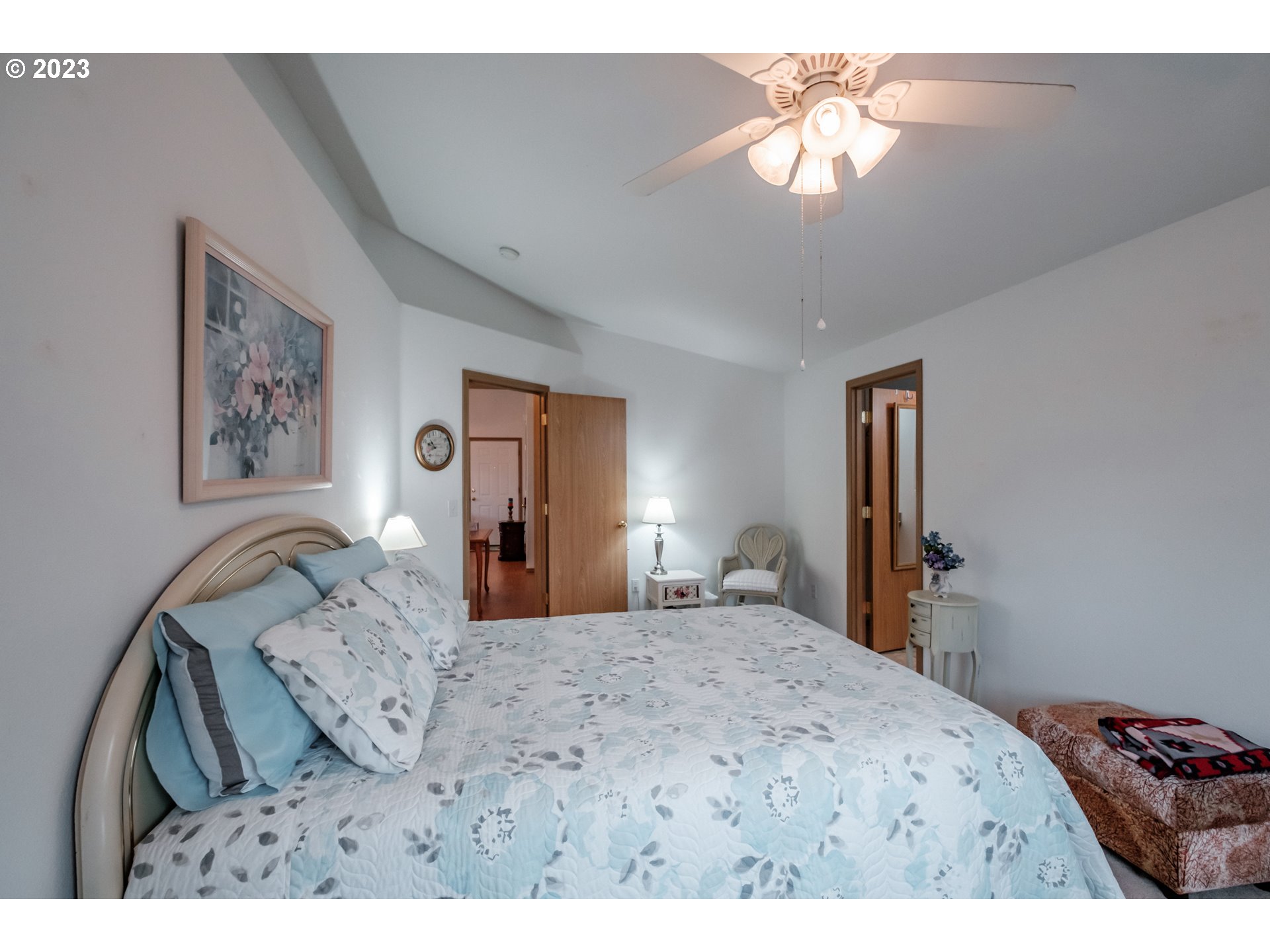 1329 Briar Road Independence, OR 97351 - Photo 11 of 27 a bedroom with a bed and a chandelier