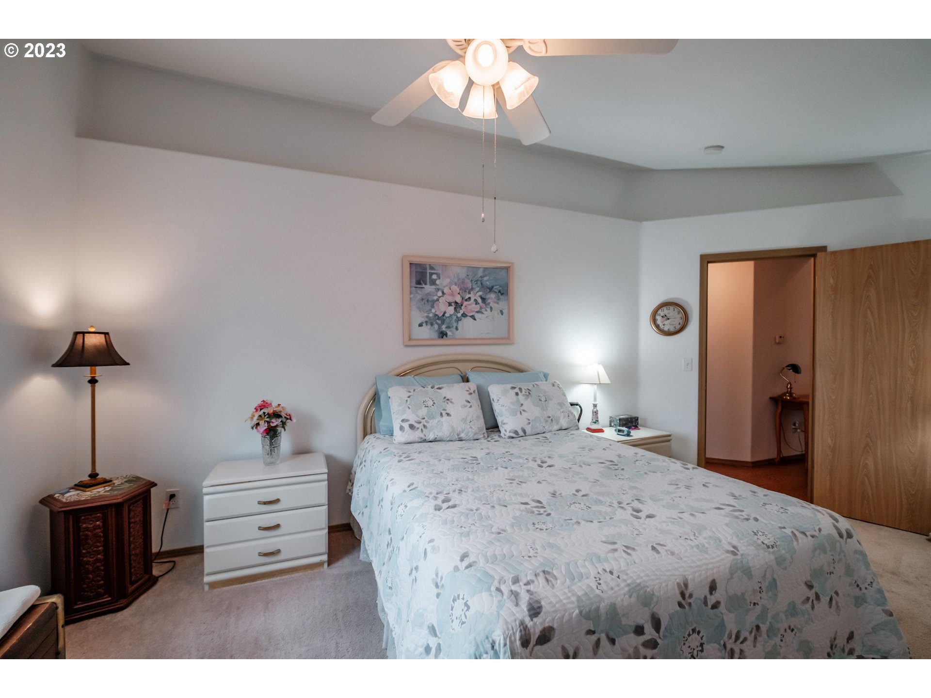 1329 Briar Road Independence, OR 97351 - Photo 12 of 27 a bedroom with a bed and a chandelier