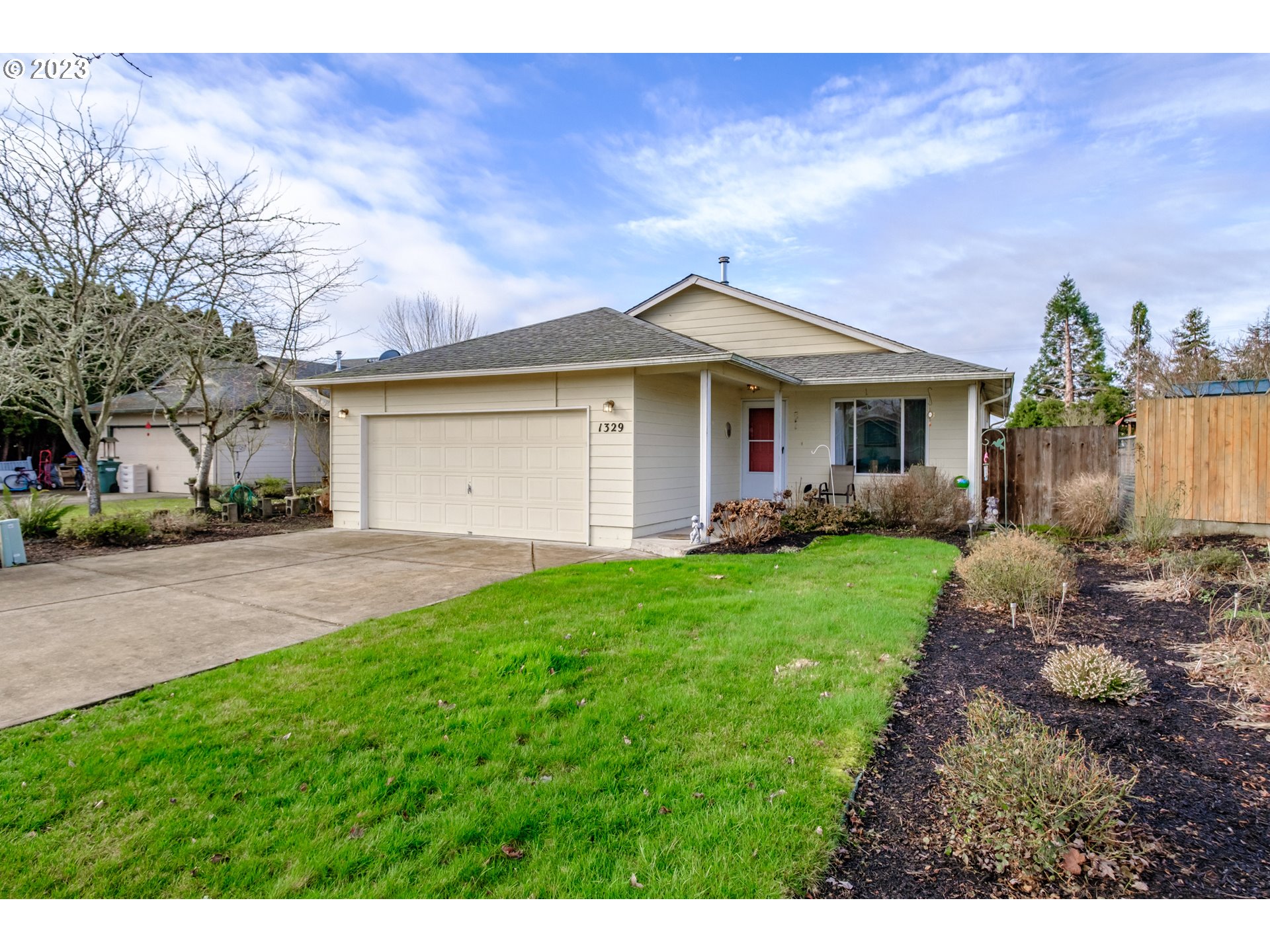 1329 Briar Road Independence, OR 97351 - Photo 2 of 27 a front view of a house with a garden and yard