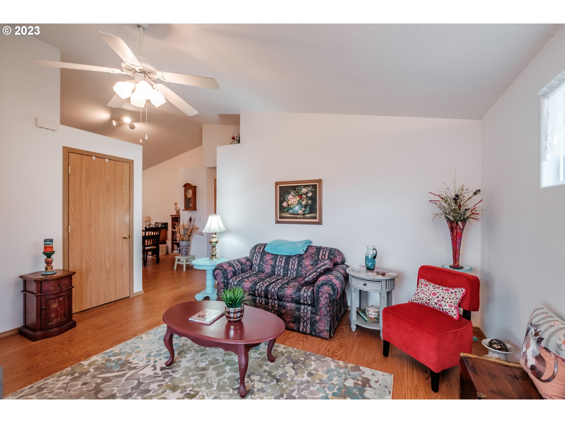 1329 Briar Road Independence, OR 97351 - Photo 5 of 27 a living room with furniture a rug and a chandelier