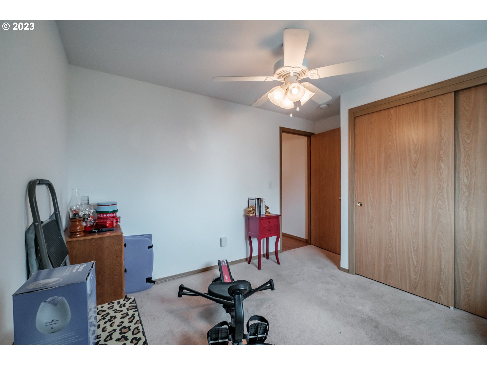 1329 Briar Road Independence, OR 97351 - Photo 9 of 27 a workspace with furniture closet and a chandelier fan