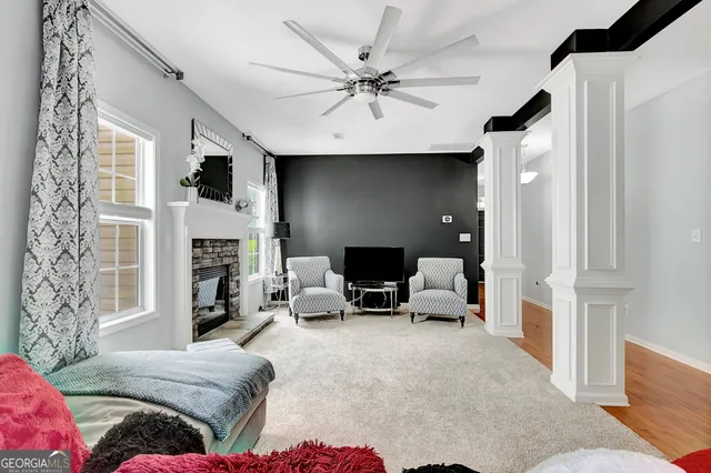 a living room with furniture and a fireplace