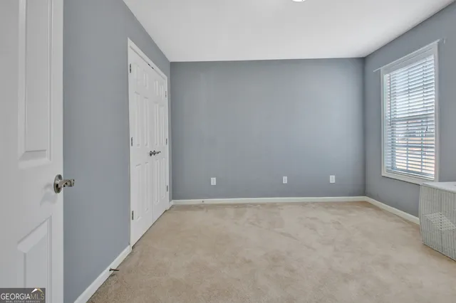 a view of a hallway with a wooden floor