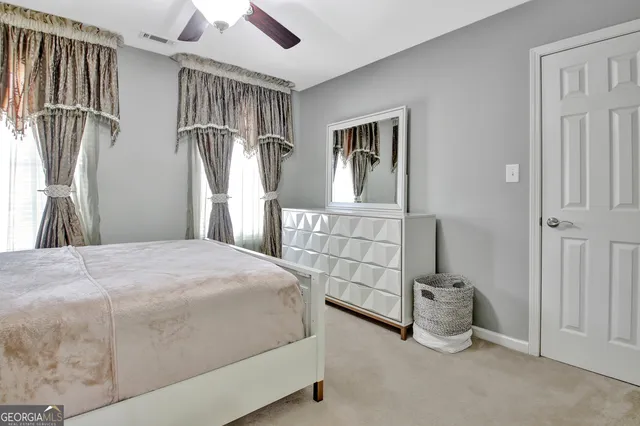 a bedroom with furniture and a window