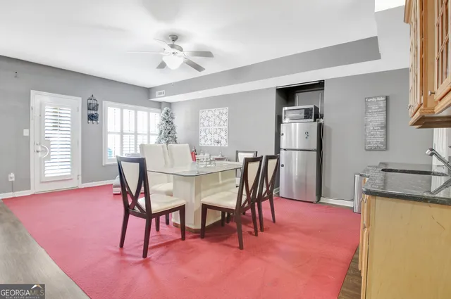 a kitchen with stainless steel appliances granite countertop a refrigerator and a stove