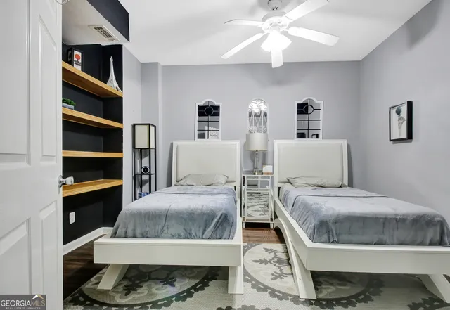 a bathroom with a double vanity sink and mirror