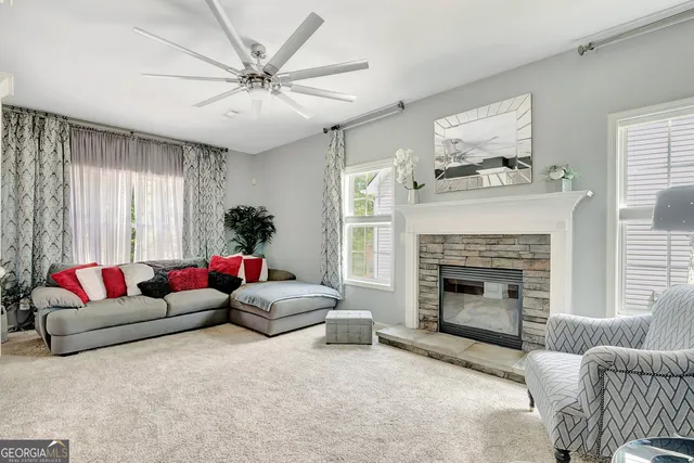 a living room with furniture and a fireplace