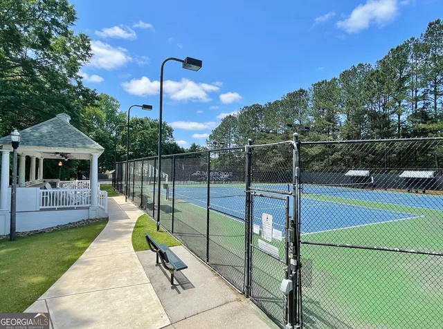 a view of a swimming pool with a in the background