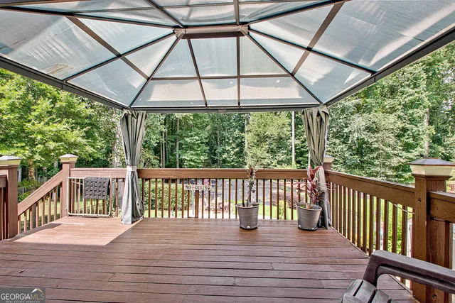 a view of a deck with wooden floor and outdoor space