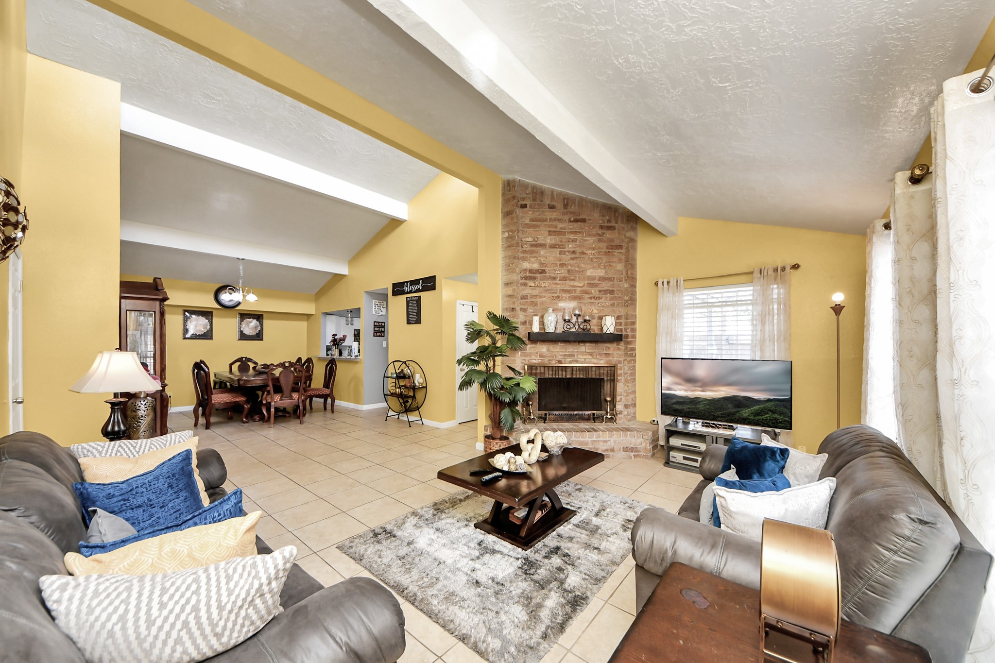 4155 Amir Street Houston, TX 77072 - Photo 14 of 43 a living room with furniture and a fireplace