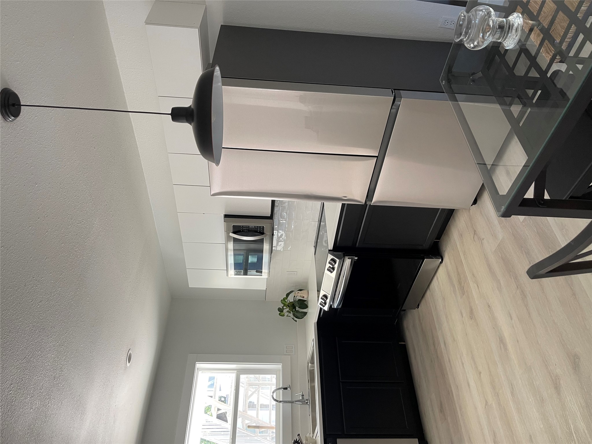 1714 Enfield Road, Unit 104 Austin, TX 78703 - Photo 12 of 14 A well-appointed kitchen features sleek appliances and generous counter space.